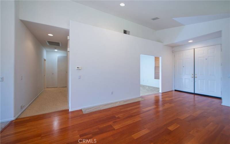 Living room, double door entry, flex room and hall to the bedrooms.