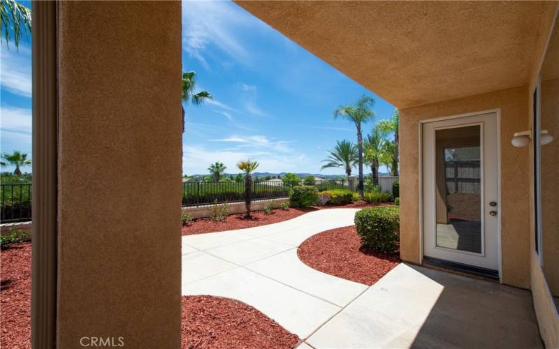 Covered patio, lush back yard and forever views.