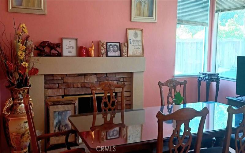 Dining room with a cozy fireplace