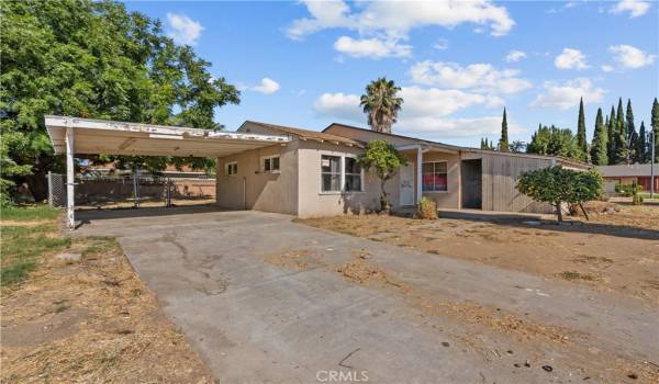 East facing front yard with carport.