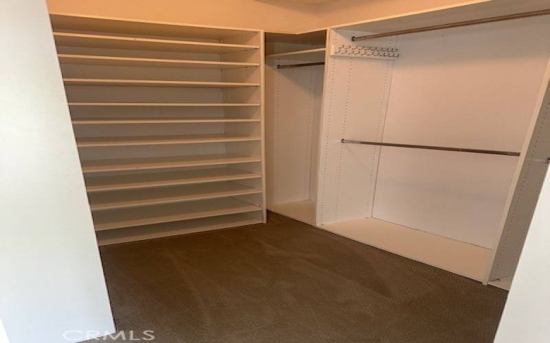 Main bedroom Closet with organizers. Custom Closet