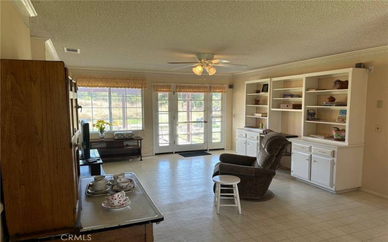 Family room with built in desk/bookshelves