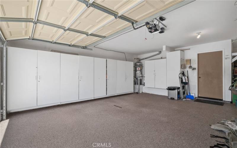 The garage floor is finished in Cleancrete and has lots of built-in cabinets.