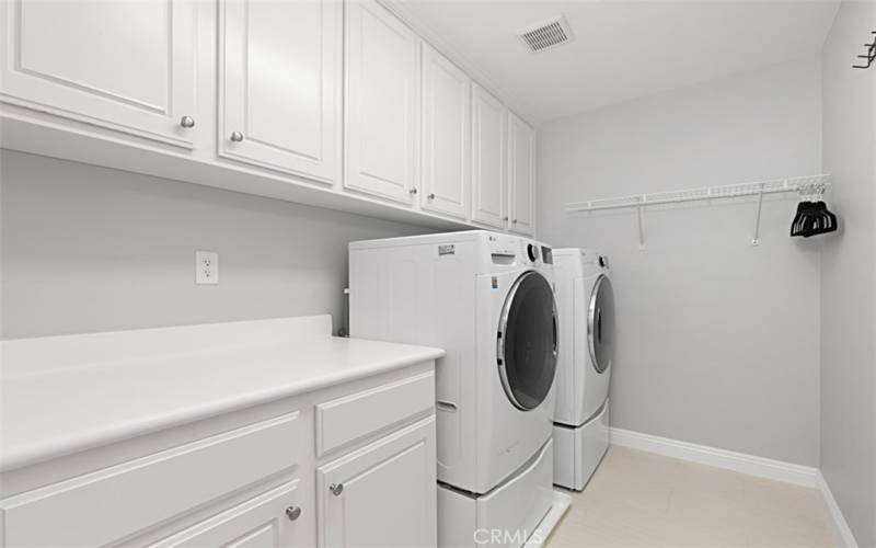 Laundry room with lots of storage cabinets