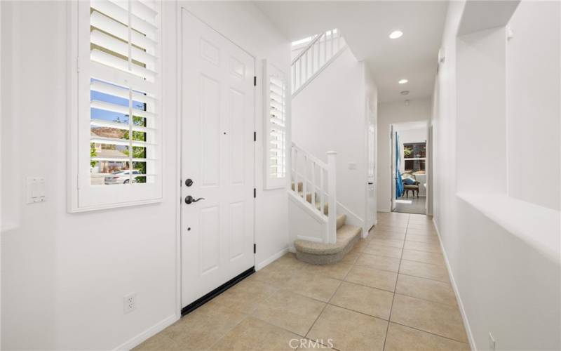 Hallway to Master bedroom, powder bath, and stairs