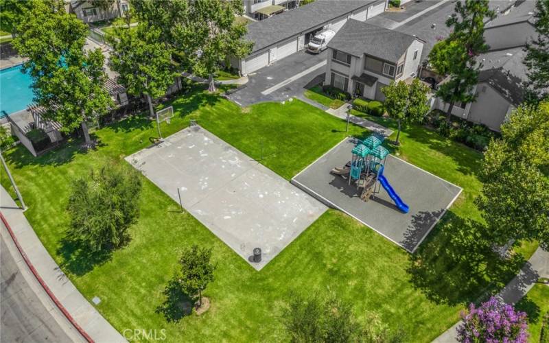 Aerial view of pool, basketball court & playground