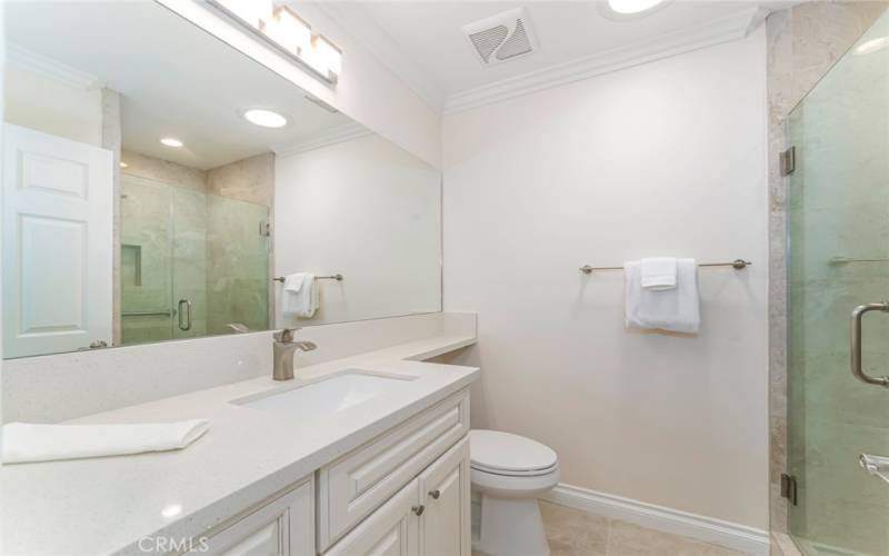 Guest bathroom with quartz countertops and new cabinetry