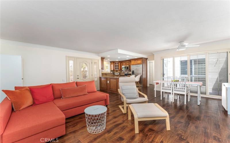 Living room with view into kitchen