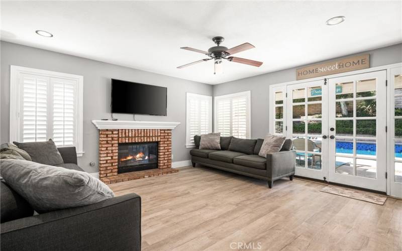 a family room with views of the pool