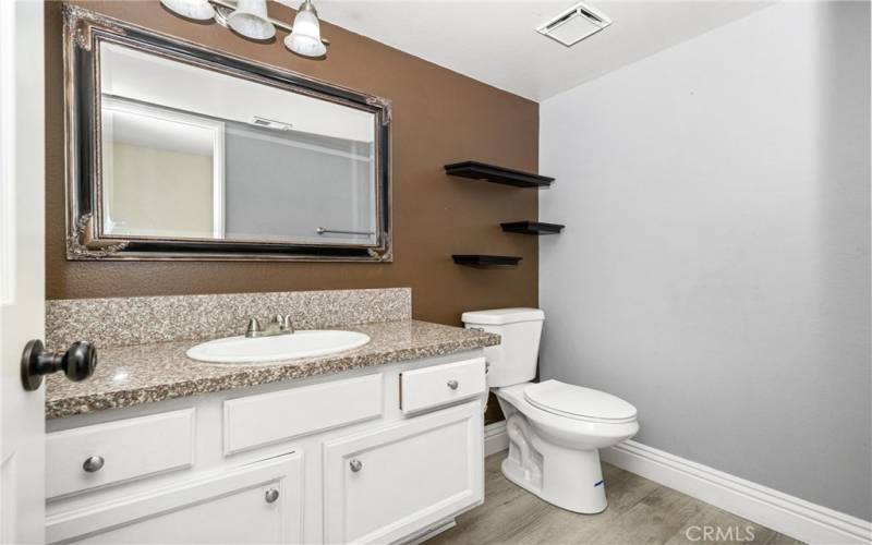 an upgraded vanity, with granite countertops