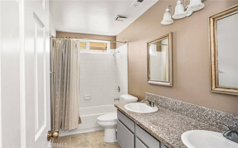 enjoy double sinks and expanded counterspace in the upstairs guest bathroom