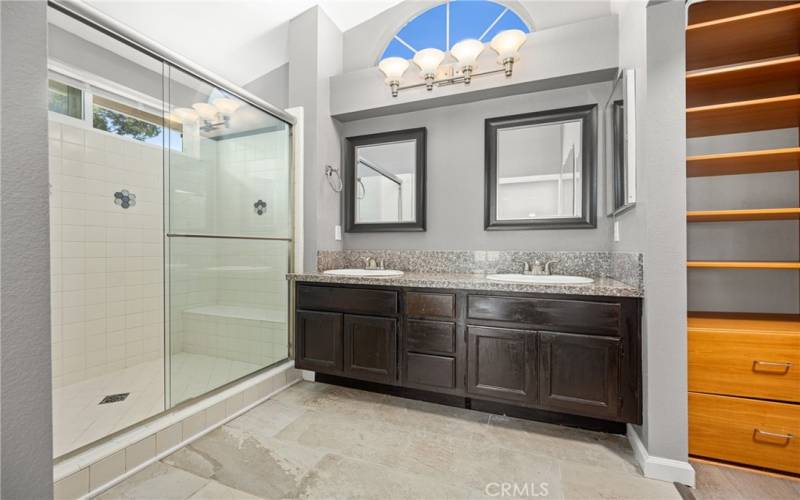 With dual vanities, and a seamless walk-in shower