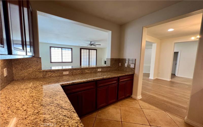 kitchen showing great room and dining room