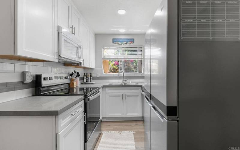 Updated kitchen with stainless appliances and natural light.