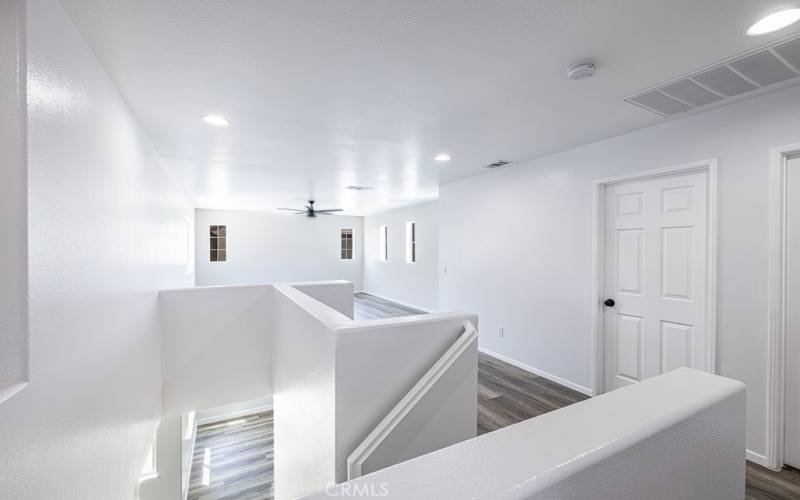 Stairs, hallway facing 1st bedroom, loft