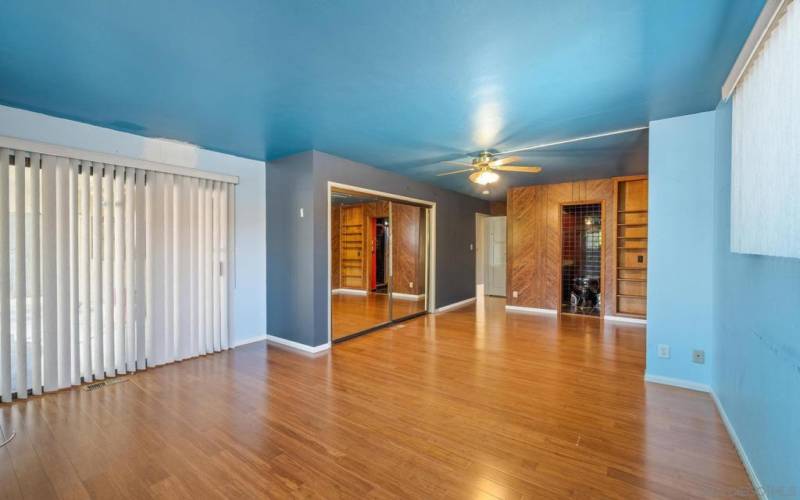 This was the original primary bedroom.  There is a sliding glass door to the backyard and an en suite bathroom.