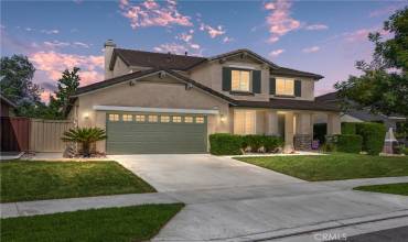 Front of home with 4 car tandem garage