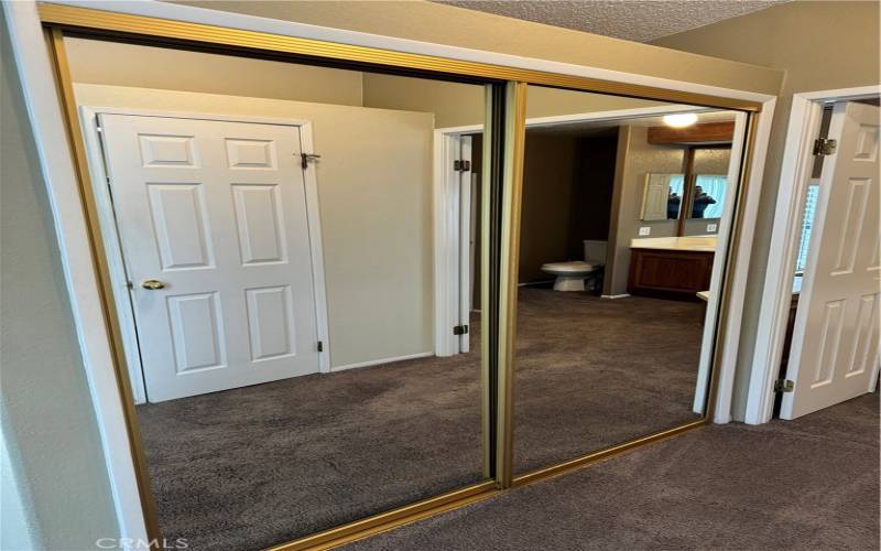 Main Bedroom Suite features mirrored wardrobe