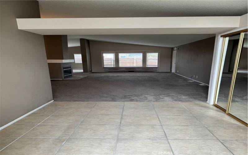 Spacious Entry Hall opens to cathedral ceilings