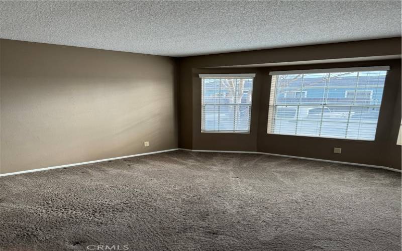 Bedroom 3 features bay window overlooking front yard