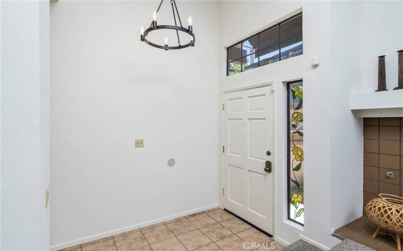 Spacious entry leading to living room