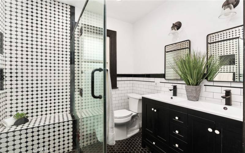 This walk in shower has a nice shelf too!