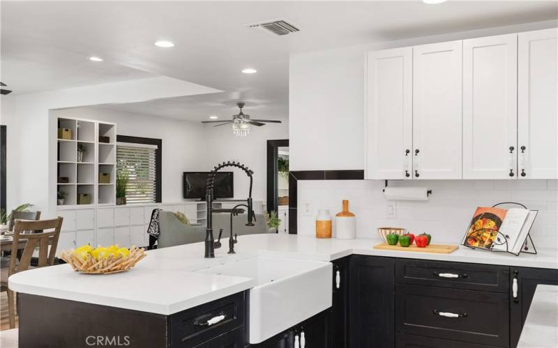 The kitchen has a great view of the living room too. Very convenient to talk with friends and family as meals are prepared.