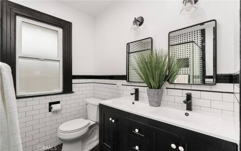 The hall bathroom was just completely updated. It features double sinks and a cool subway tile vibe.