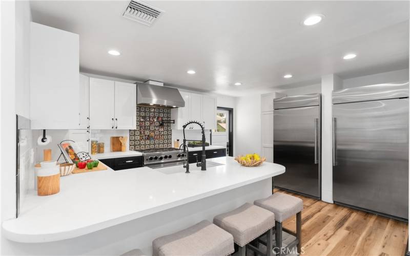 The gourmet kitchen is wonderful. Notice the SEPARATE built-in refrigerator (right) and freezer (left).