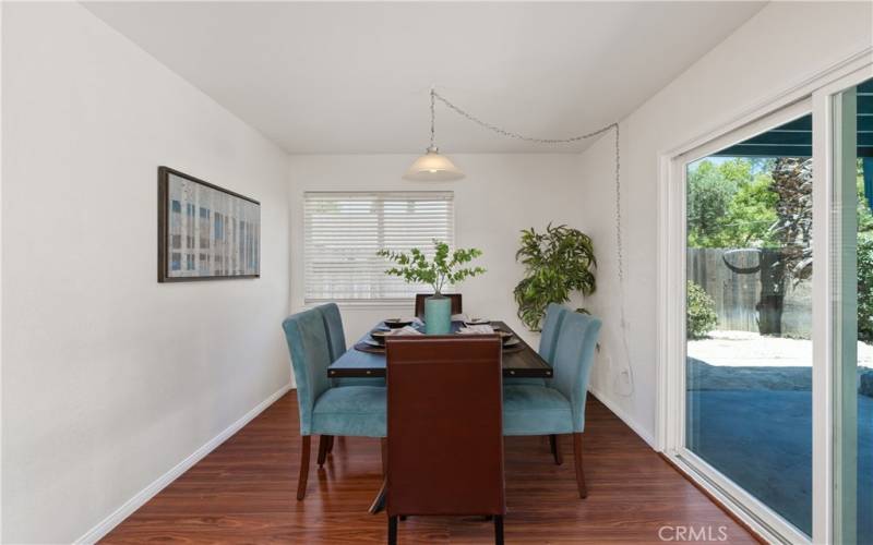 Either way, it is a great space with a sliding door to the back covered patio. The patio is seamlessly integrated into the living space between the living room and family room.