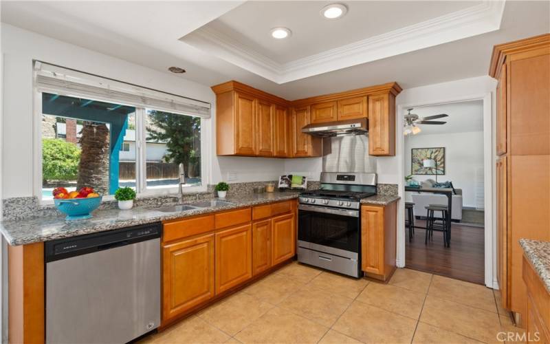 The kitchen is conveniently situated between the living/dining room and the family room.