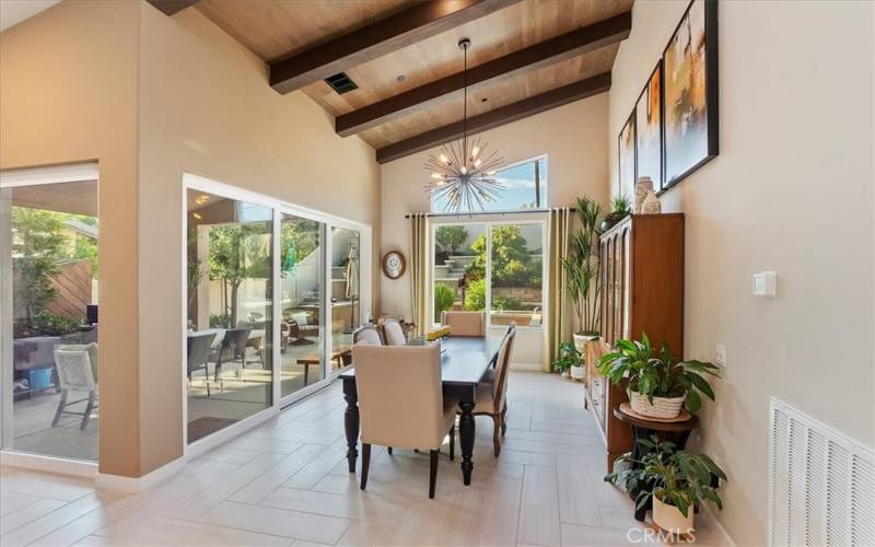 Floor to Ceiling Windows & Sliders give this home Wonderful Natural Light, as well as Beautiful Views of the Serene Yard & Patio Areas