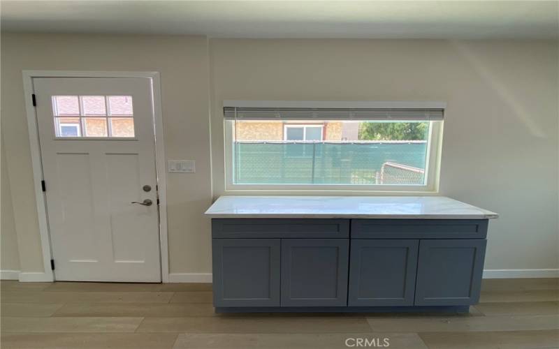 Front Door. New Kitchen Island .Cabinets with Corian Counters