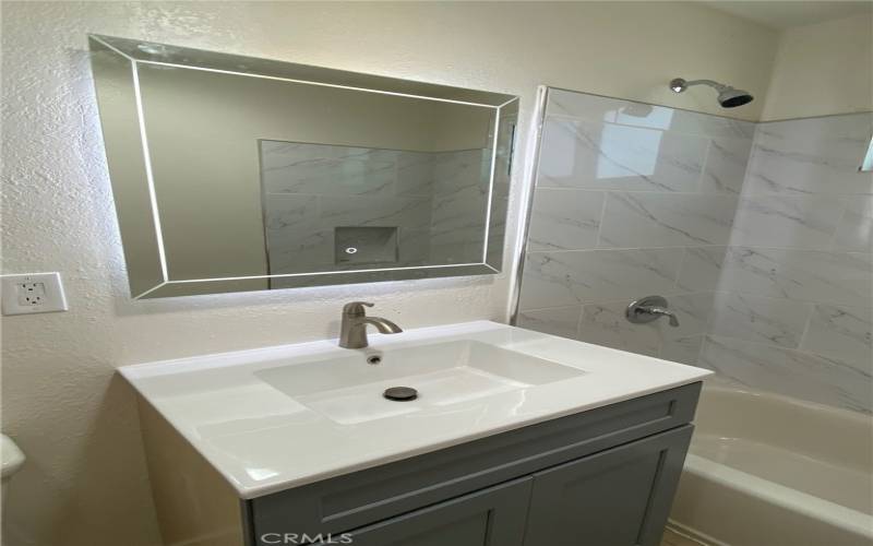 Front Unit Bathroom with New Cabinets, Mirrors