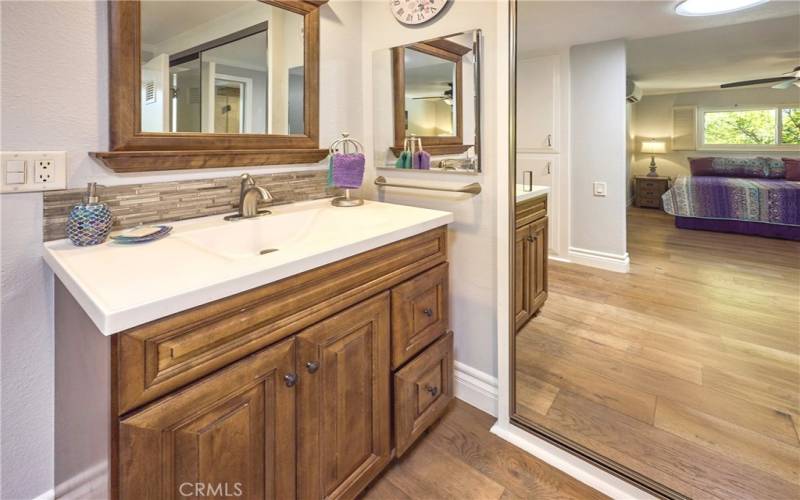 Main ensuite bathroom; vanity and mirrored closet doors