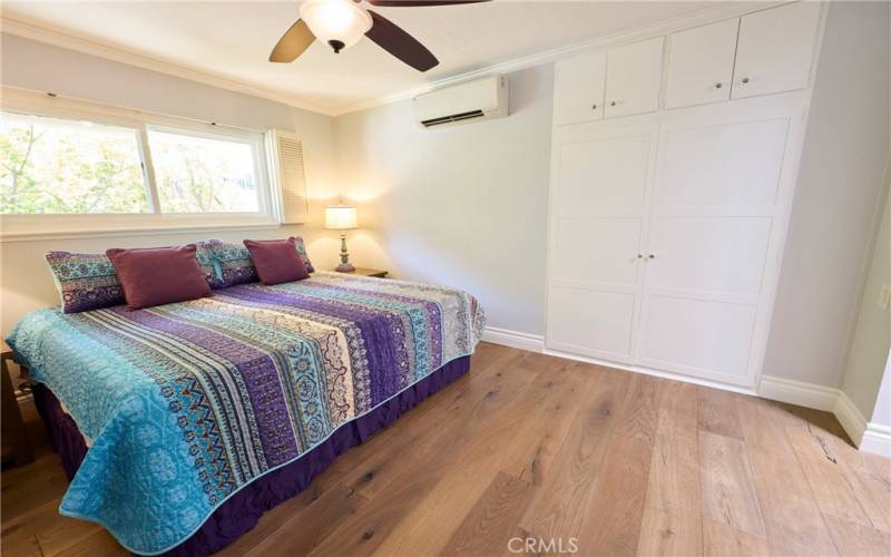 Ensuite main bedroom with built in storage closet, ceiling fan and zone A/C and heat