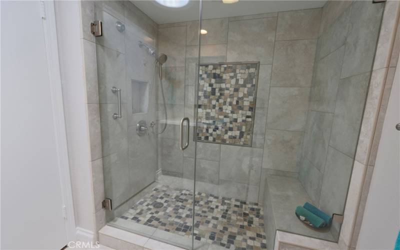 Luxurious walk in shower, seamless glass shower door and showerhead with water filter