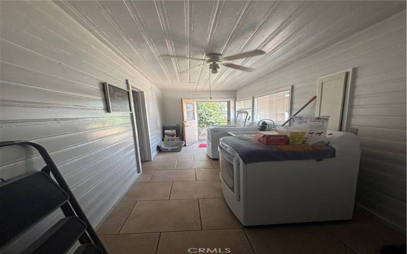 Laundry room.  The door to the left is the third bedroom in the rears of the property.