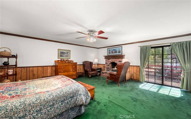 Primary bedroom with fireplace and two walk in closets