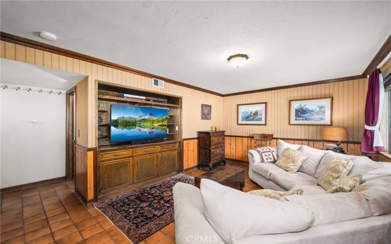 Downstairs family room with alternate second front door entry with quick access to stairway