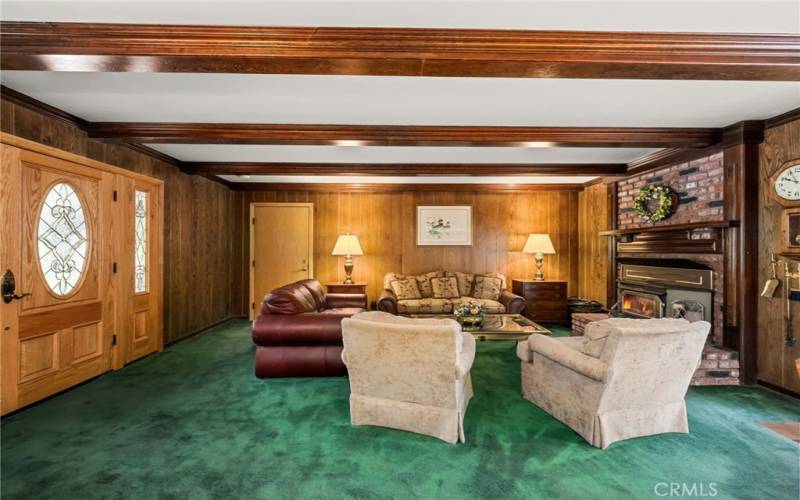 Formal living room complete with crackling fireplace