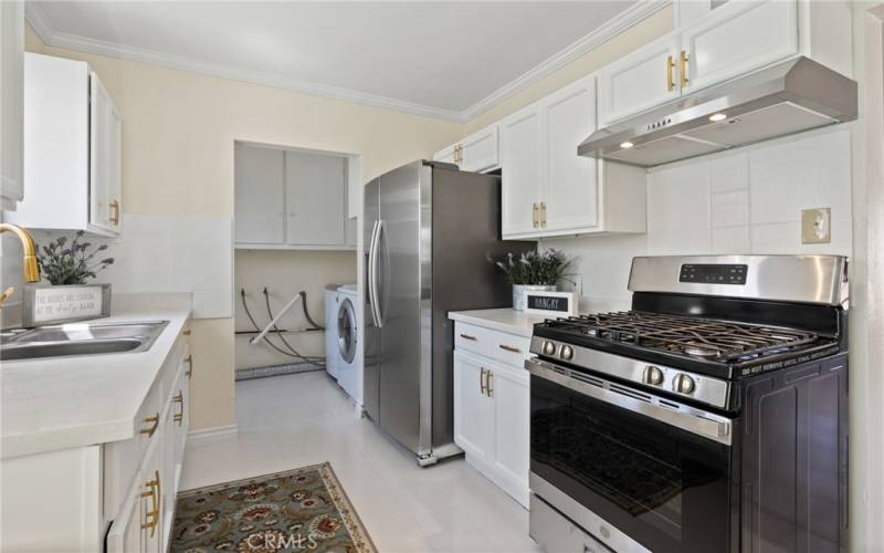 Kitchen with new stove new hood, new faucet