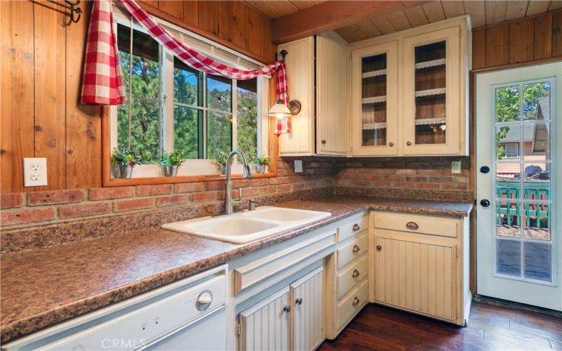 Fantastic kitchen looking out to a very large deck with brand new spa