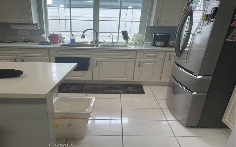 Cozy kitchen with Pella windows over the sink