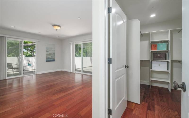 primary bedroom w/ custom closet