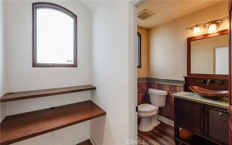 Office nook and powder room off the living area.