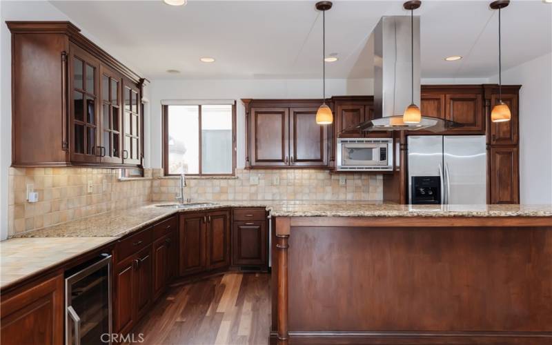 This kitchen has it all, including a breakfast bar and wine refrigerator (not that you'd want that for breakfast. Or would you ;) ?