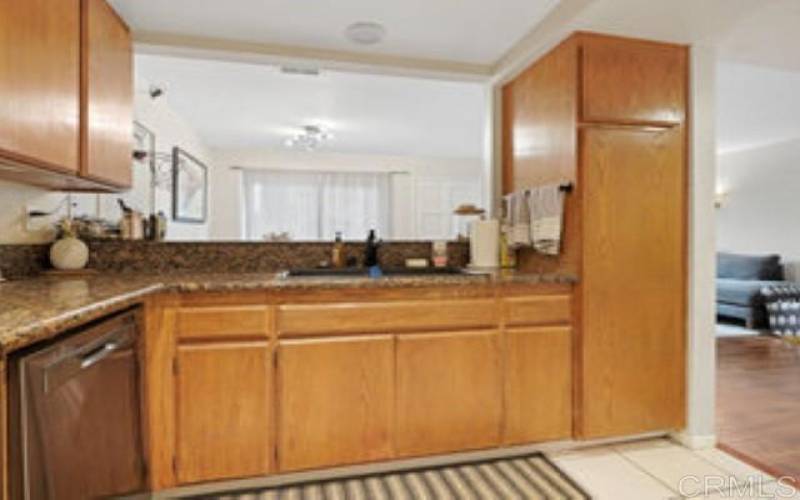 View of Kitchen back toward the Bar Countertop and Dining Room