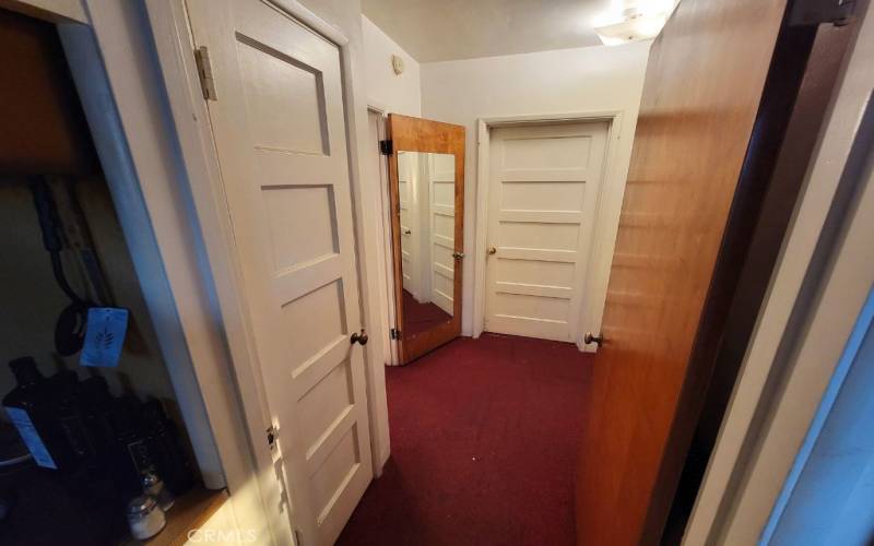 BRIGHT HALLWAY LEADING TO BEDROOMS