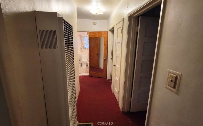 BRIGHT HALLWAY LEADING TO BEDROOMS